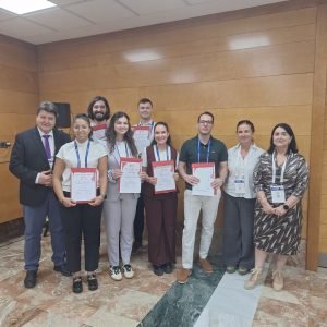 Group of young students receiving diplomas participation