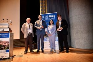 3 men's and 1 women on a prize ceremony